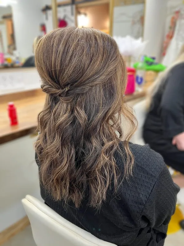 Half-up style with caramel highlights by Halo Salon in Crystal Springs, MS