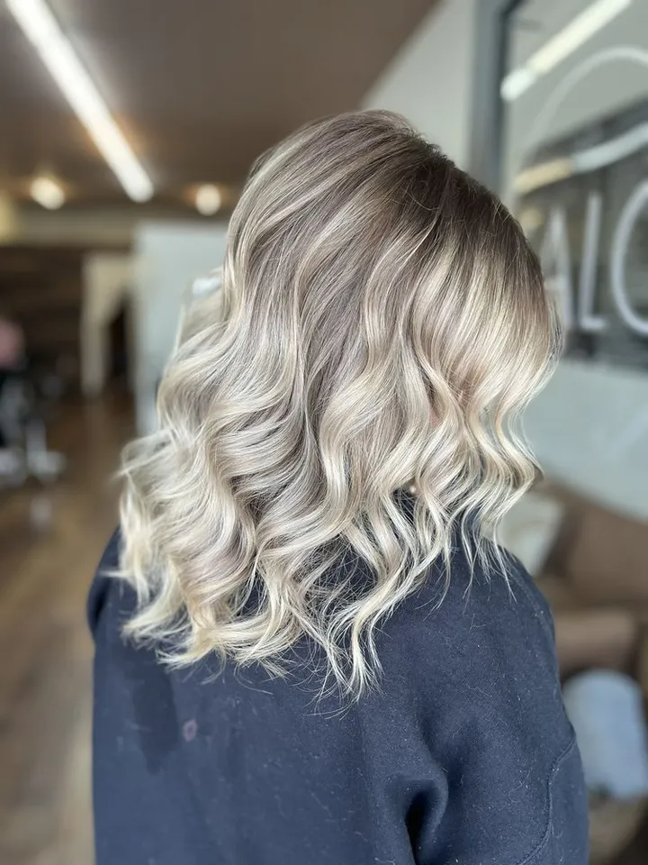 Dimensional blonde waves by Halo Salon in Crystal Springs, MS