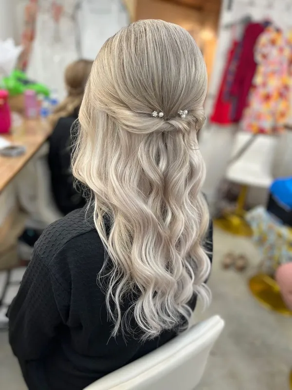 Bridal half-up style with pearl pins by Halo Salon in Crystal Springs, MS